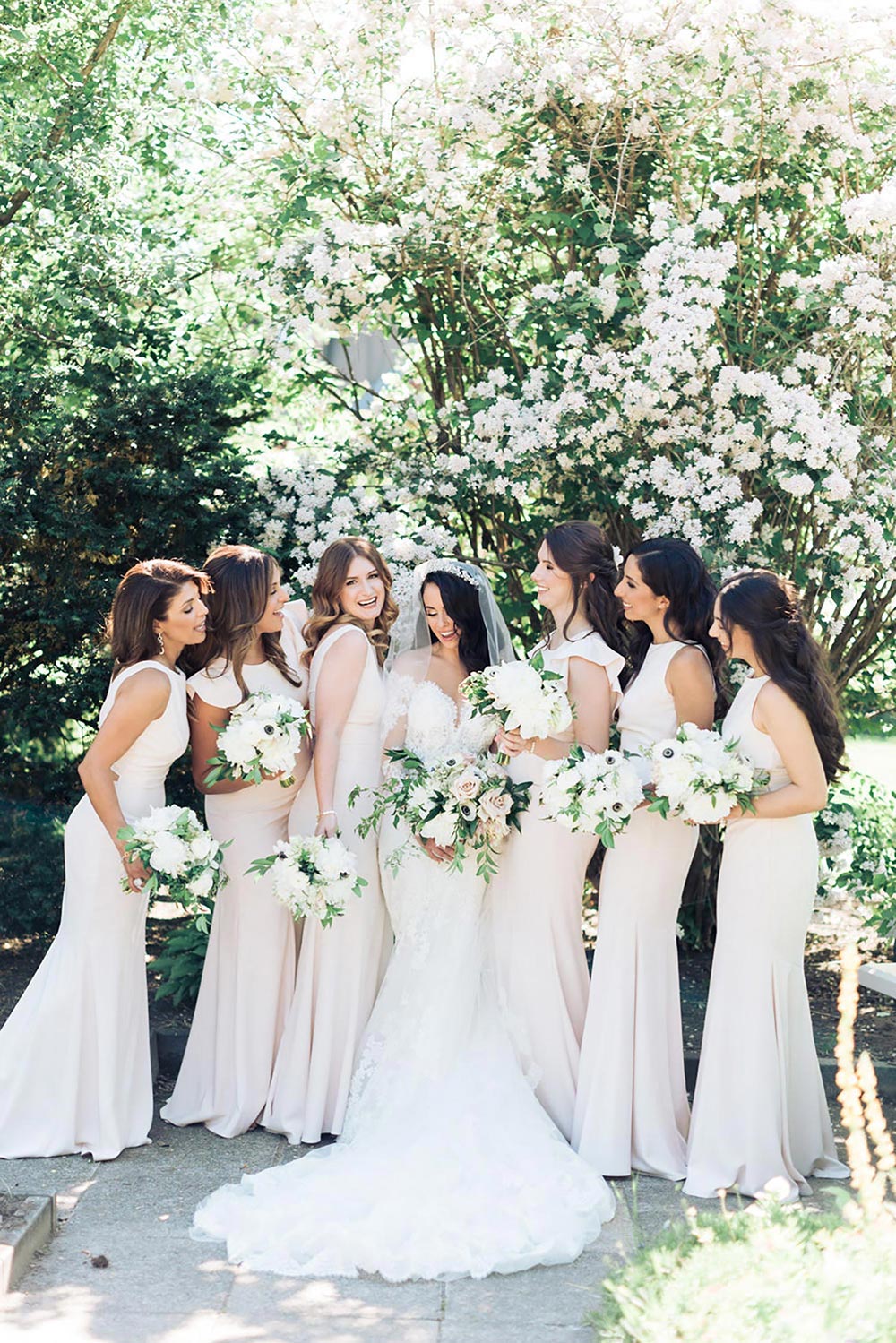 long sleeve wedding dress with neutral bridesmaid dresses